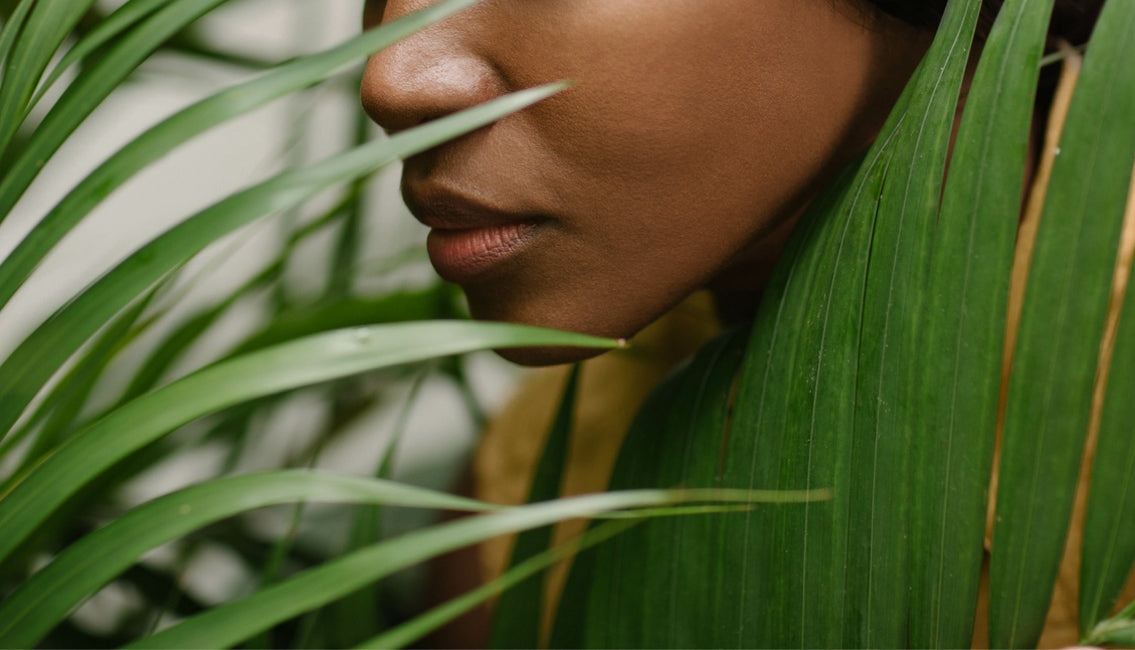 Woman smelling plants