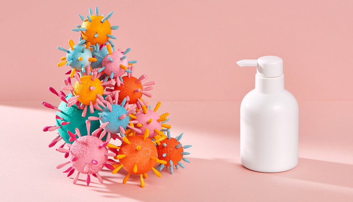 Germs and bottle of disinfectant