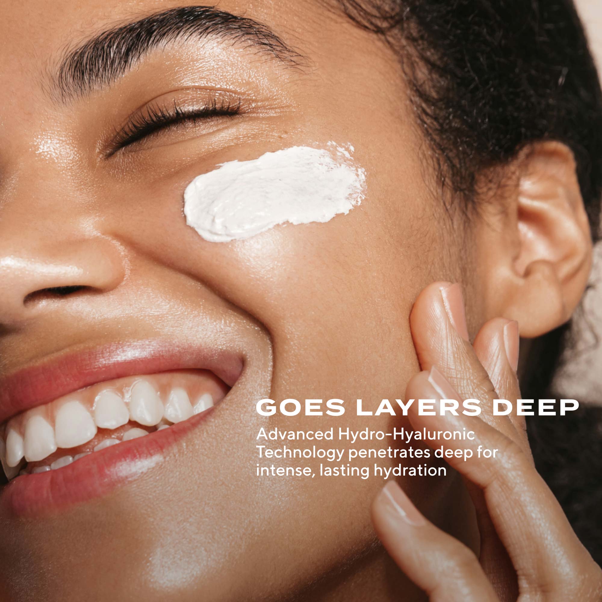 woman smiling with product texture of Murad Restorative Hydro-Hyaluronic Cream on cheek