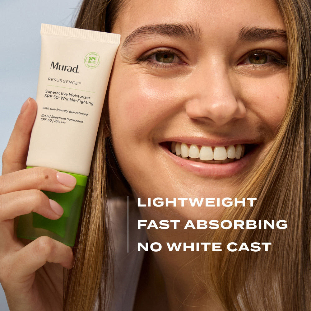 woman holding Murad SPF 50 Wrinkle-Fighting