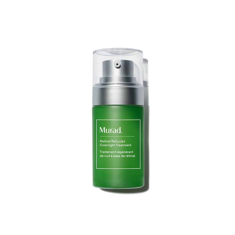 Green skincare bottle with silver cap on a white background