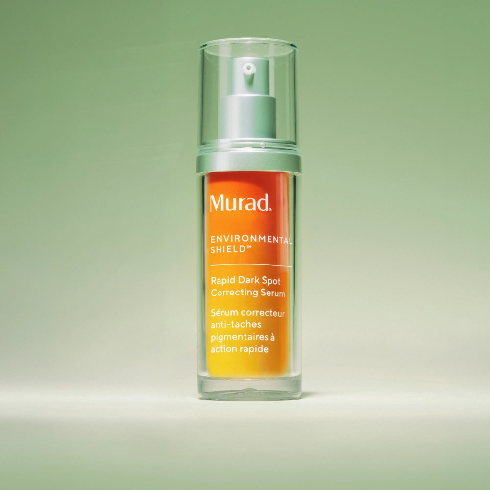 Murad Environmental Shield Rapid Dark Spot Correcting Serum bottle on a gradient green background